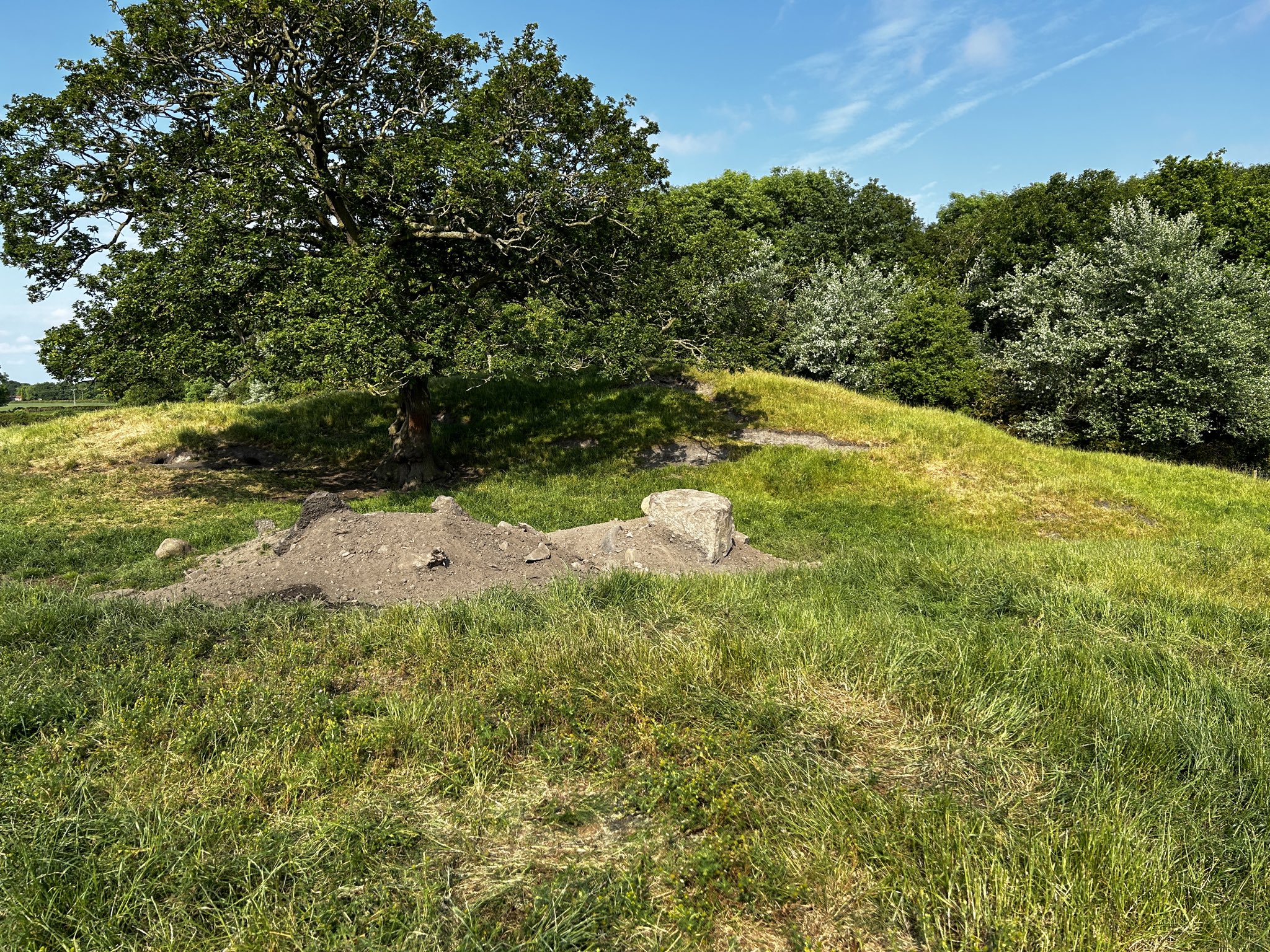 Further remains of the Andrew Pit, with the waste mound and stonework, in 2023