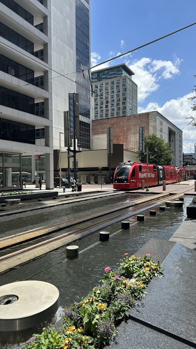 The <a href="/METROHouston/">METRO Houston</a> light rail runs through the middle of a fountain, which is super cute.

I only wish the fountain was on when the cars came through (they shut off right before)