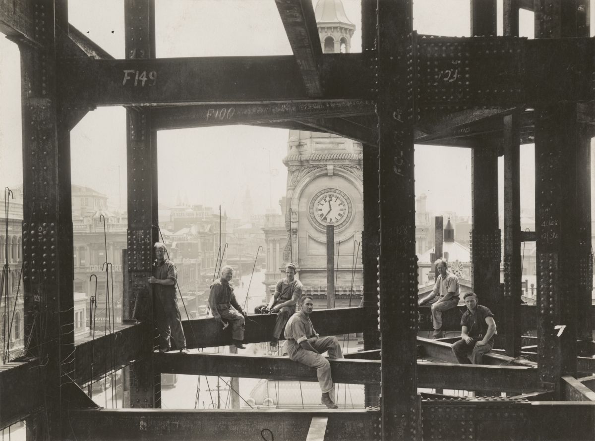 #FlashbackFriday: Construction workers on the steel framework of the Dunedin Chief Post Office. The Stock Exchange clock is seen, with a view to the north along Princes St. The photograph was published in the Evening Star on 8 Jan 1935. The official opening was 14 Apr 1937.