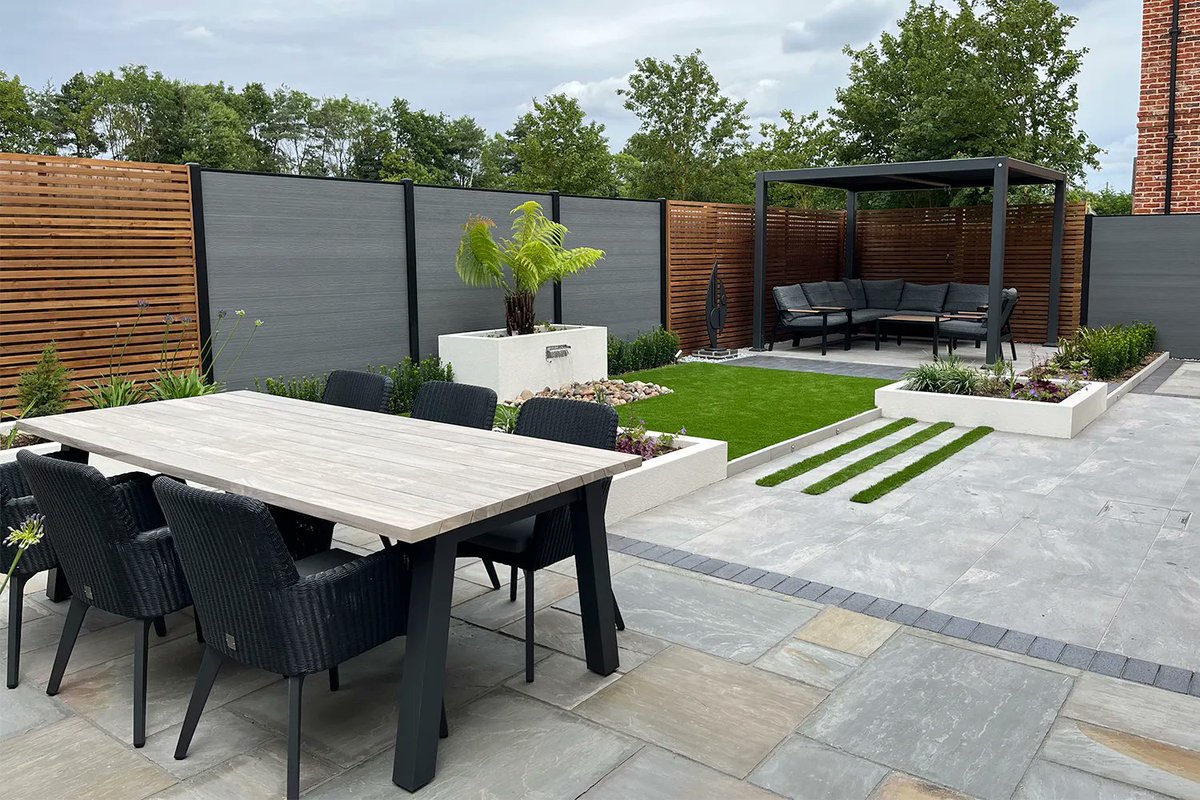 Newly completed garden in Wix, Essex. The prominent boundaries are now an attractive balance of redwood and composite panels from @charlesandivy. A @suns_lifestyle pergola completes the scheme to provide a shaded corner seating area.#gardendesign #gardendesignessex
