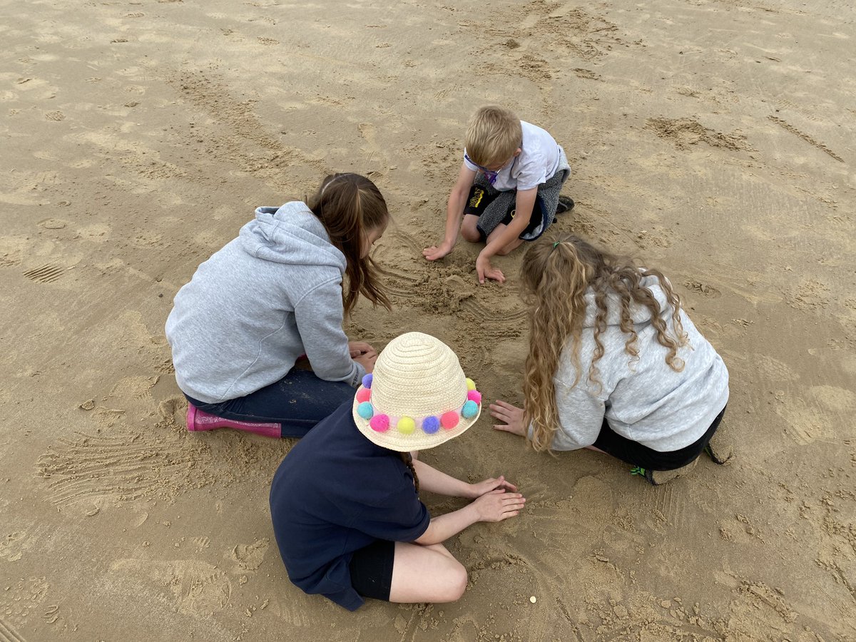Year 3 creating some wonderful beach art creatures at West Runton.