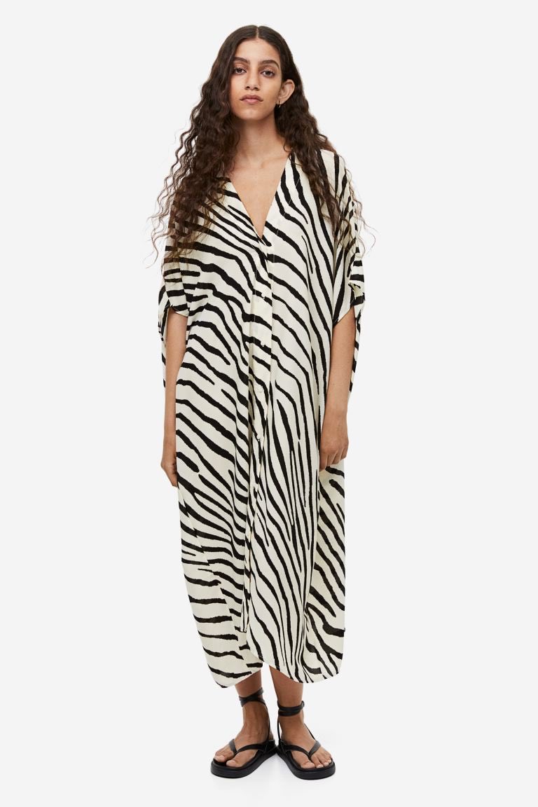 HGavin's tweet image. I know pink is the first choice but this black &amp;amp; white Kaftan as in Barbie’s first bathing suit is really calling my name #understoodtheassignment #maybe