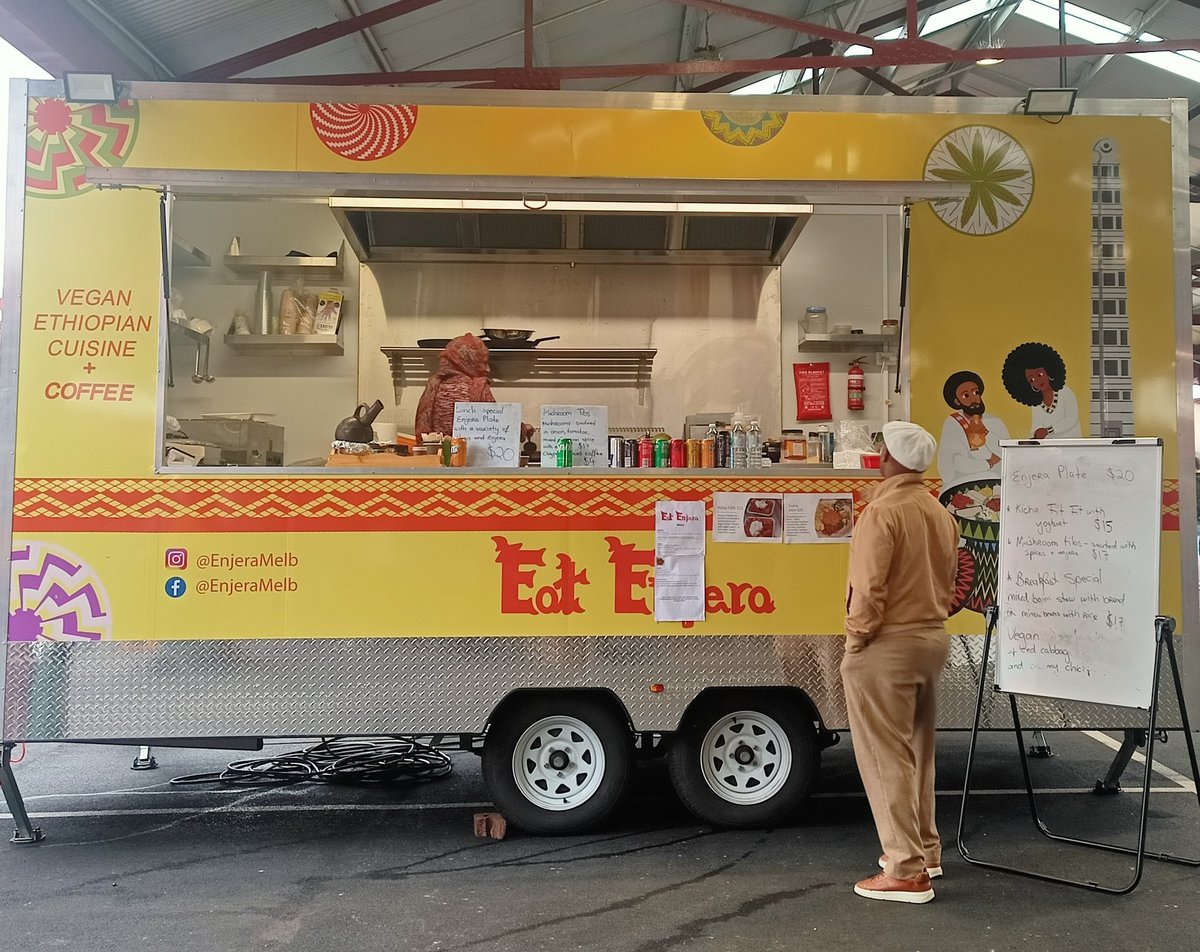 Rituparna37's tweet photo. Him, like me, wondering, what vegan Ethiopian food is after all. 
#victoriamarket #Melbourne https://t.co/RQAKubmnoN