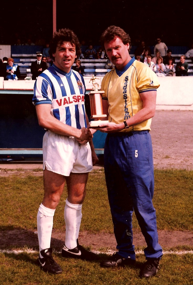 Halifax Town's Rick Holden receives the Player of the Year award for 1986/87 from visiting manager Mick Jones (then at Peterborough), who had signed him for Town. 📷Keith Middleton.