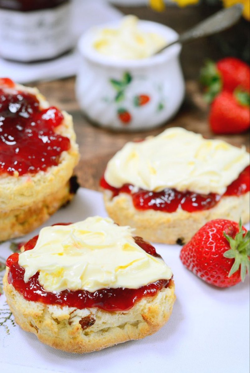 A cream tea is a form of afternoon tea, consisting of tea served with a combination of scones, clotted cream, jam, and sometimes butter. Though a particular speciality of Devon and Cornwall, cream teas are offered in many locations in tea rooms. 
🍃🍓🍰☕️🫖🍃
#NationalCreamTeaDay