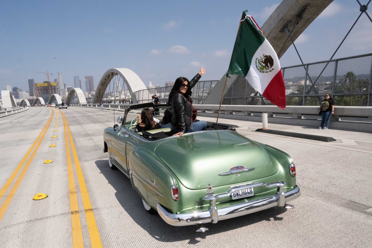 6thStViaduct's tweet photo. Earlier this month, we had the privilege of helping to commemorate the 80th anniversary of the Zoot Suit Riots on the Sixth Street Viaduct A caravan of vintage cars crossed the bridge with people both young and old dressed in Zoot Suits. Check out some photos from the event! 📸🚗 https://t.co/sDMOBcADE4