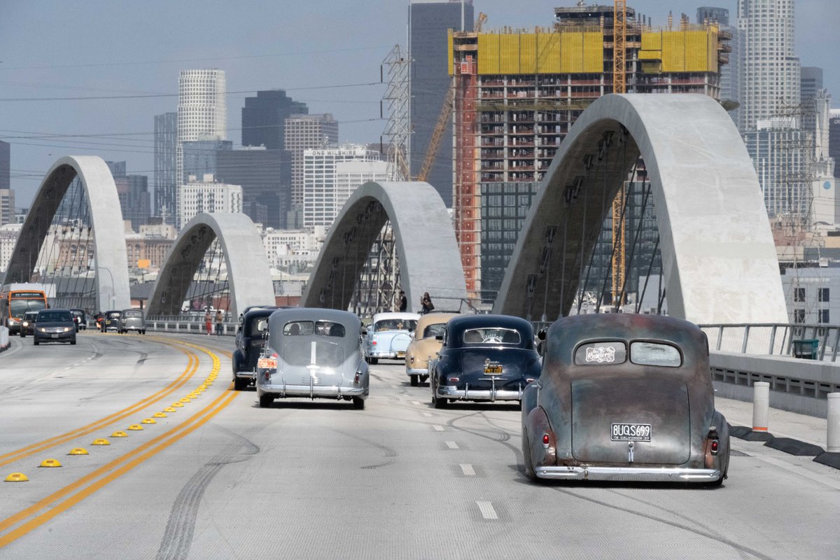 6thStViaduct's tweet photo. Earlier this month, we had the privilege of helping to commemorate the 80th anniversary of the Zoot Suit Riots on the Sixth Street Viaduct A caravan of vintage cars crossed the bridge with people both young and old dressed in Zoot Suits. Check out some photos from the event! 📸🚗 https://t.co/sDMOBcADE4