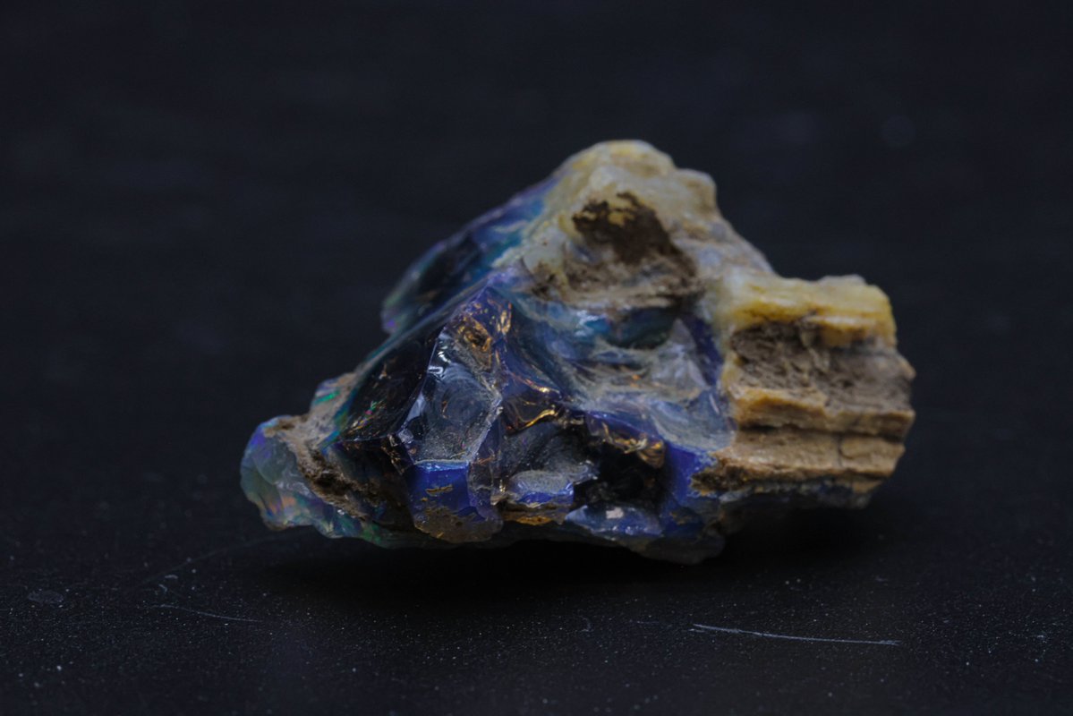 Unearthing the geological magic of wood opal! This extraordinary gemstone, formed through the replacement of organic material by silica, showcases a captivating fusion of wood patterns and opalescent shimmer. It's like nature's artistry frozen in time!