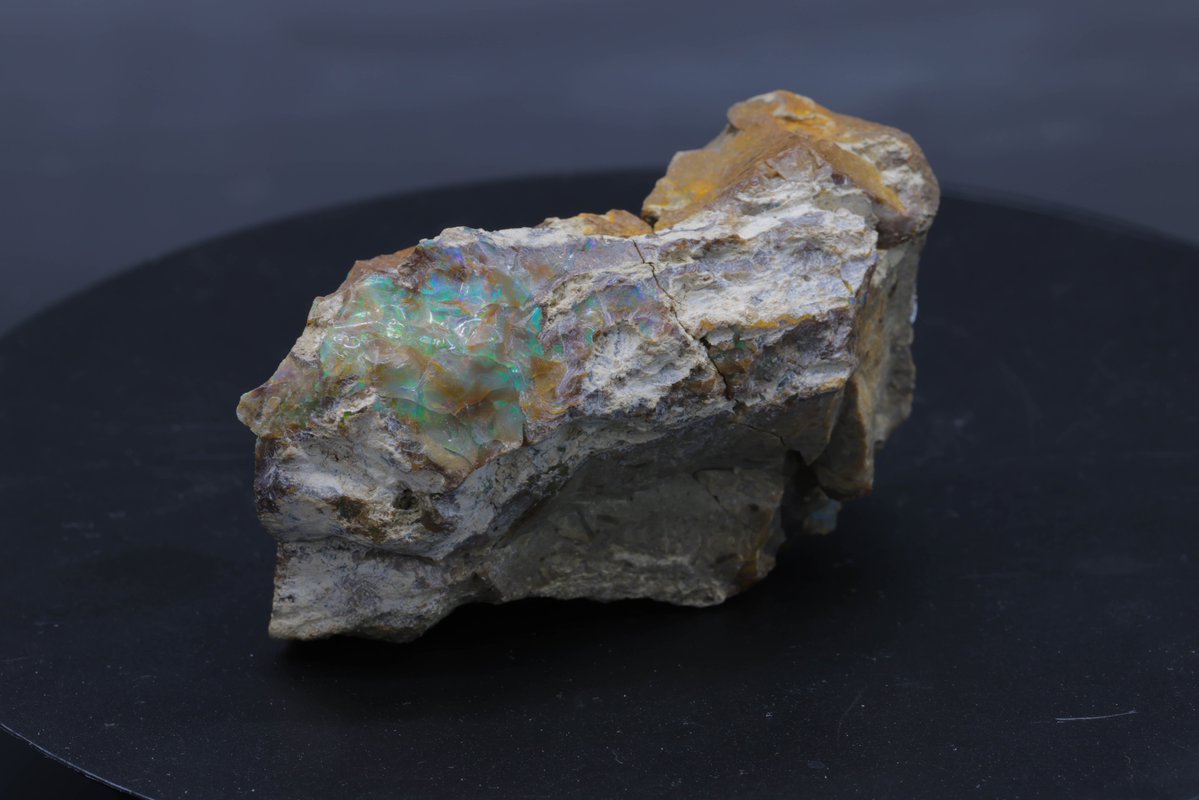 This gemstone dazzles with its play-of-color, revealing a kaleidoscope of vibrant hues. Formed in ancient volcanic hydrothermal systems, Ethiopian opal shows the full interplay between water and silica, resulting in its mesmerizing iridescence.