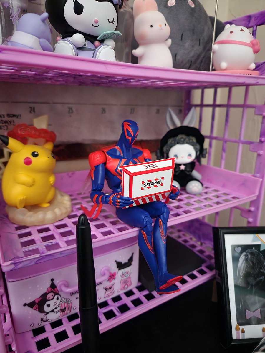 purrwitch's tweet photo. I feel like this is a good place to mention that my partner put my Miguel on my desk enjoying his TGI Friday's hot wings #AcrossTheSpiderVerse #MiguelOHara https://t.co/4XLqULNXG5