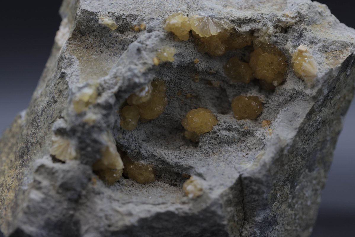 We love zeolites! This delicate and lustrous mineral, belonging to the zeolite group, forms in cavities of volcanic rocks. With peachy-pink to white hues and mesmerizing crystal formations, stilbite captures the imagination.