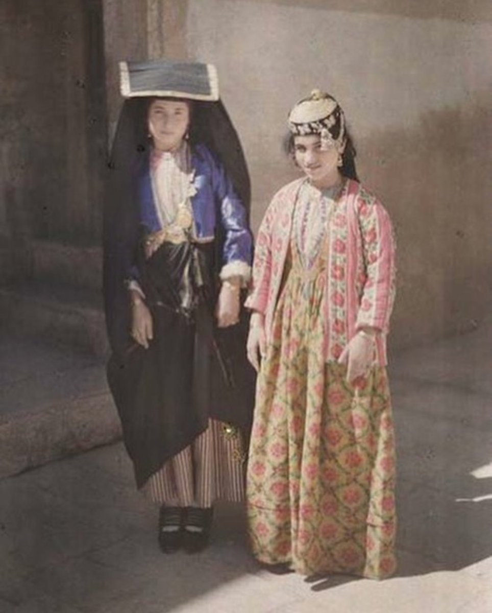 Two Assyrian girls posing on a street in Nineveh city, year 1927.  

📷: Frédéric Gadmer.