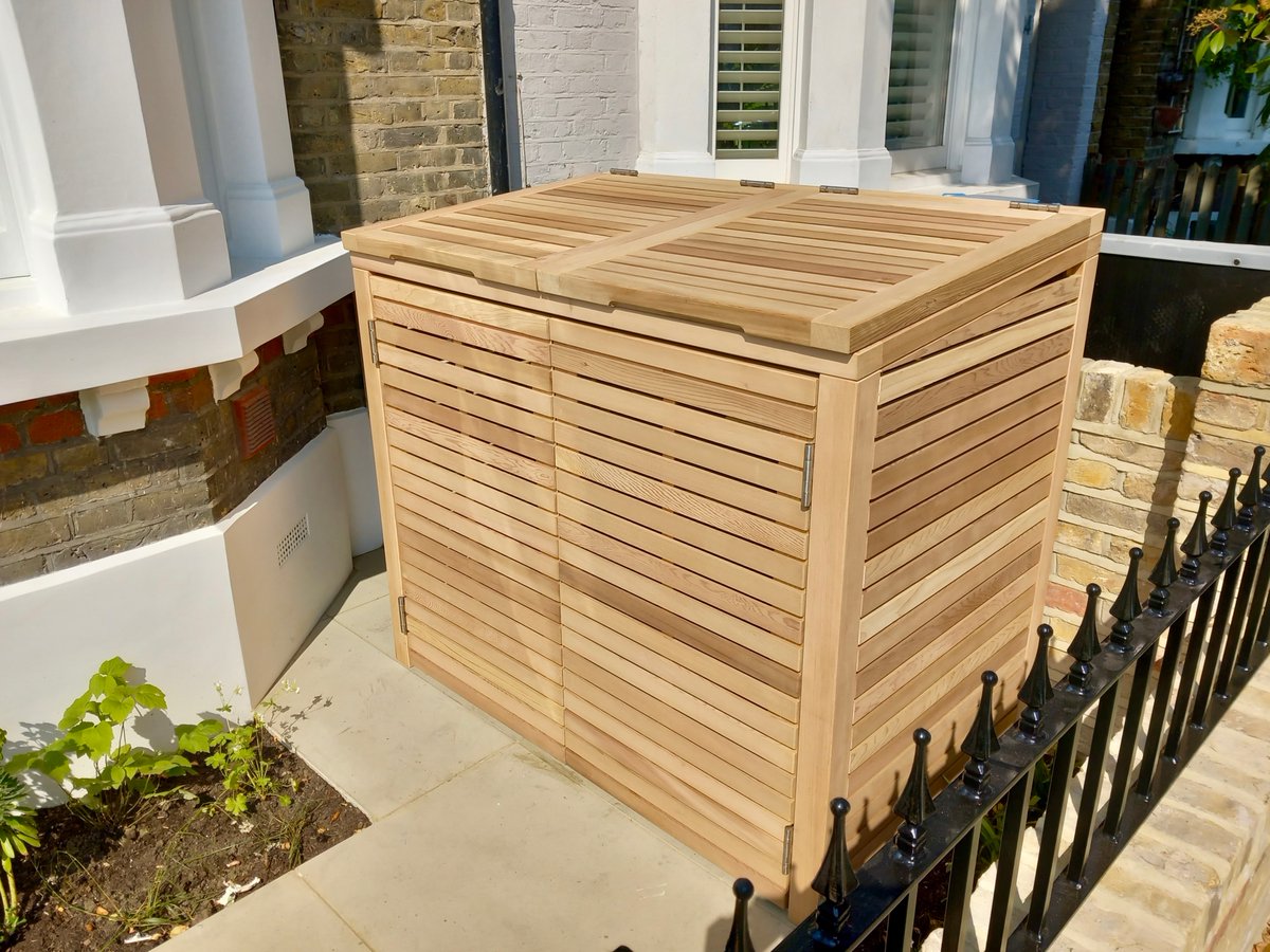 gardentrellisco's tweet photo. Smarten up your front garden and cover up wheelie bins with a Prestige Double Slatted Bin Store. Pictured here in Iroko, it is also available in Western Red Cedar, painted thermally treated timber. Order now: https://t.co/hnGThyxvHR #BinStore #BinCover #Gardening https://t.co/GA3Drk2j1Z