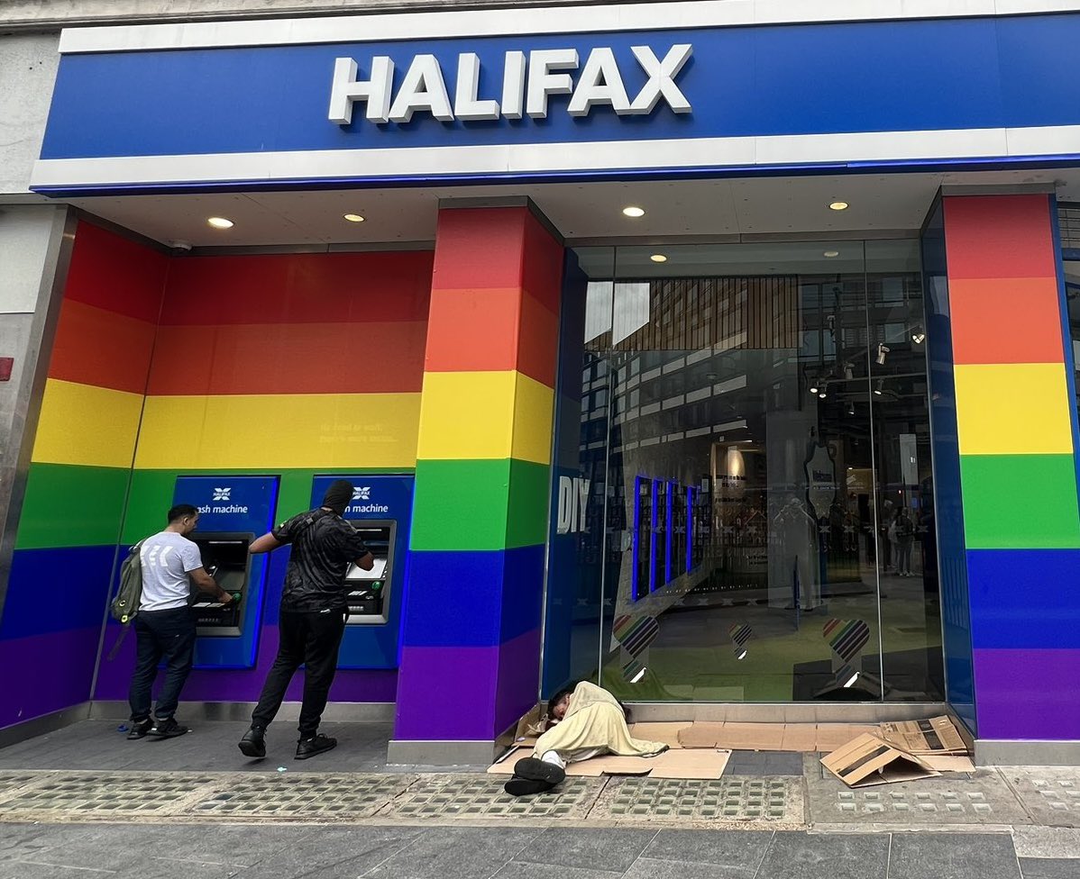 NickBuckleyMBE's tweet photo. Rather than virtue signal and waste money on rainbow paint, maybe Halifax should have supported this homeless man sleeping in their doorway to access accommodation and support. 
Real charity means achieving a tangible outcome, everything else is a waste of time and resources. https://t.co/OQJIGeZKZM