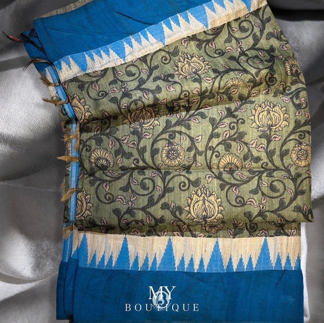 The earthy tones, vibrant hues, and intricate motifs make it a standout choice for those who appreciate traditional artistry and want to make a fashion statement.#PureTussarSaree #KalamkariArt #HandcraftedElegance #VidharvaIkatBorder #IndianTextiles #TraditionalCraftsmanship