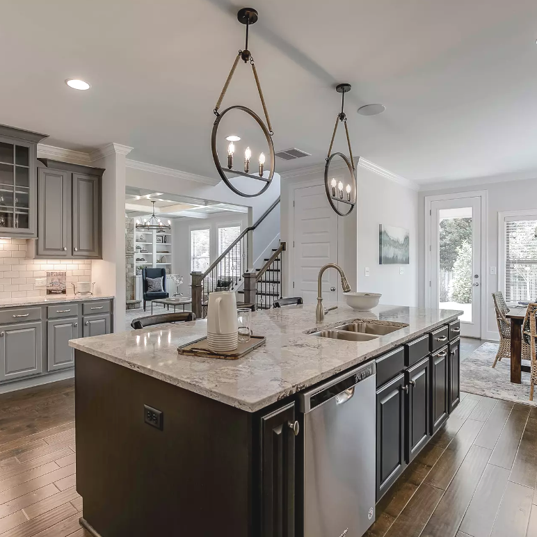 You could say we're on island time. 😉 Transform your kitchen with design inspiration from SR Homes here: bit.ly/3vGi8nO #KitchenDesignIdeas #Neutrals #KitchenIsland #KitchenLighting