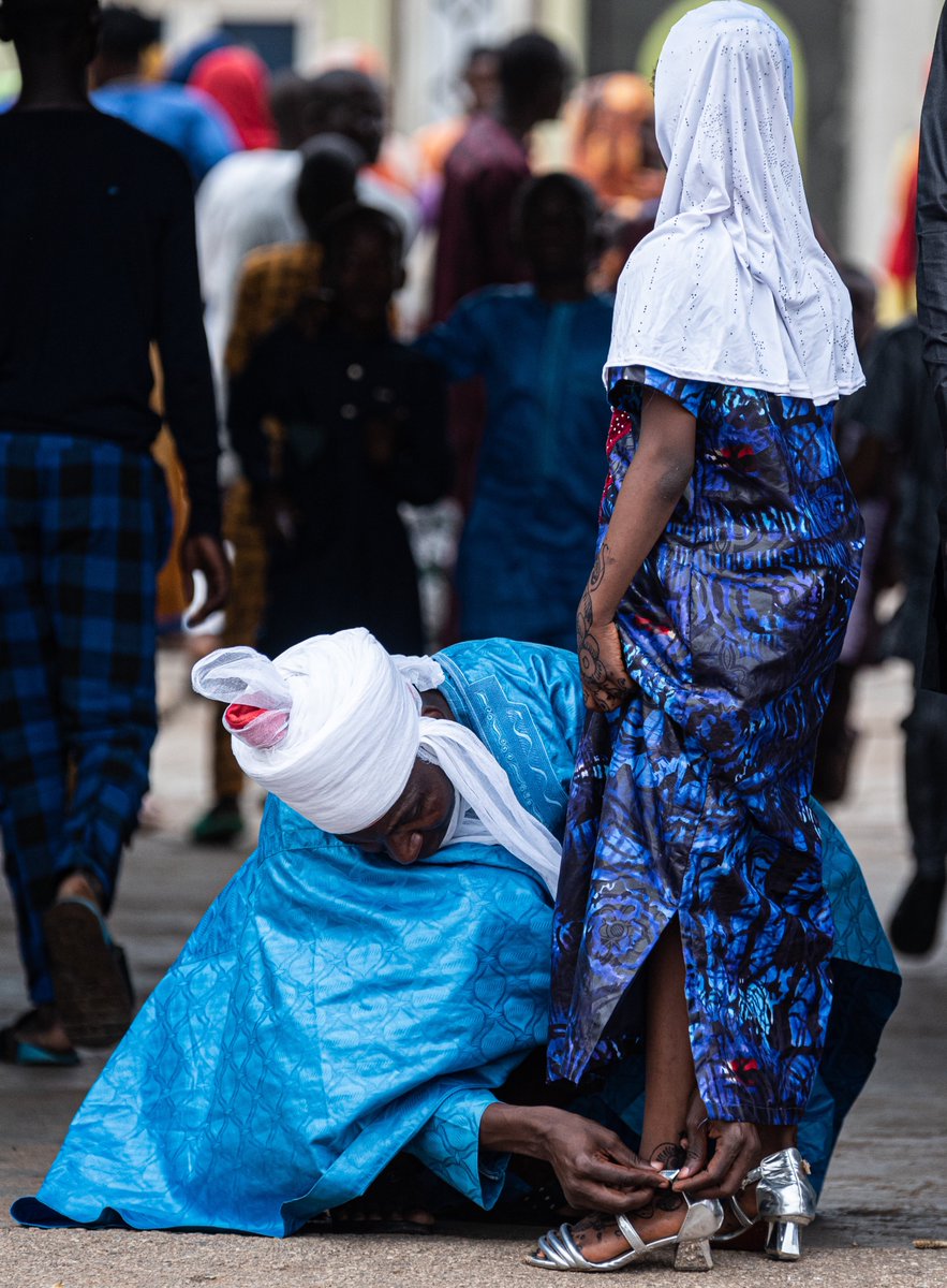 This image was created by me during the Eid celebration in Ilorin—the man in the picture is the father & the girl is his daughter (for those commenting ‘she might be his wife’).

 As a photographer I hardly express myself with words rather just let the picture speak for itself.