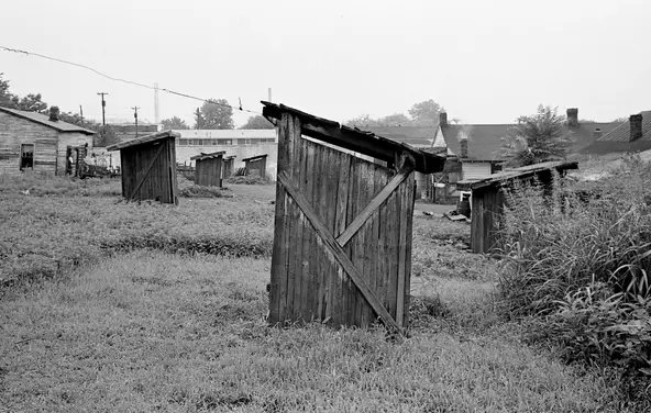 This is a picture of outhouses in the middle of Nashville, Tennessee in 1962.  Weirdly enough, this location is still a hideous empty lot 61 years later, but you can see the downtown skyscrapers from this exact location today.