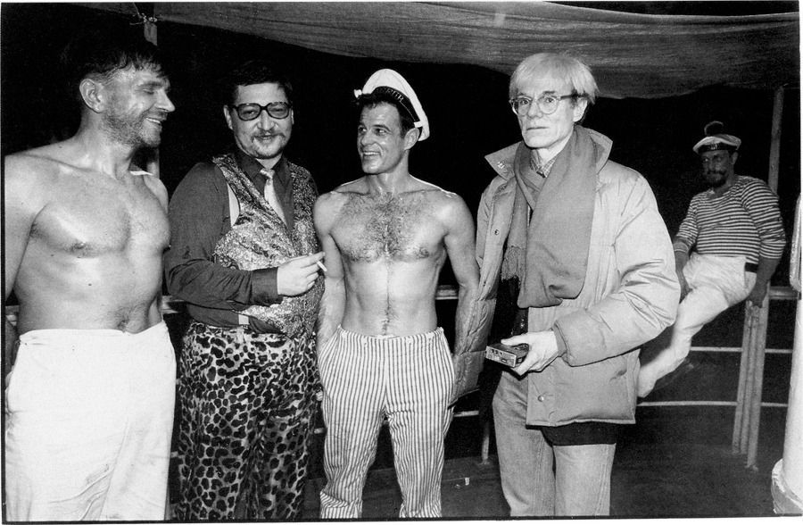 bitter69uk's tweet photo. 1/ The gang’s all here! #AndyWarhol visits the set of Querelle (1982). Left – right: actor Dieter Schidor, director #RWFassbinder, leading man Brad Davis and Warhol. Heartfelt thanks to everyone who attended the #LobotomyRoom film club’s presentation of Querelle last Thurs night! https://t.co/y63FWkc3tE