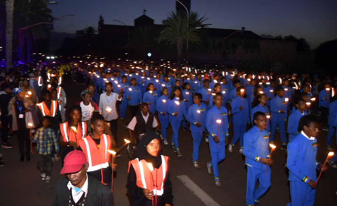 hawelti's tweet photo. Candle light vigil in Asmara on the eve of Martyrs Day; Liberation Avenue and Bahti Meskerem full to their rims with tens of thousands of residents paying homage to Eritrea's heroic Martyrs. https://t.co/ZU1wrp5pyl