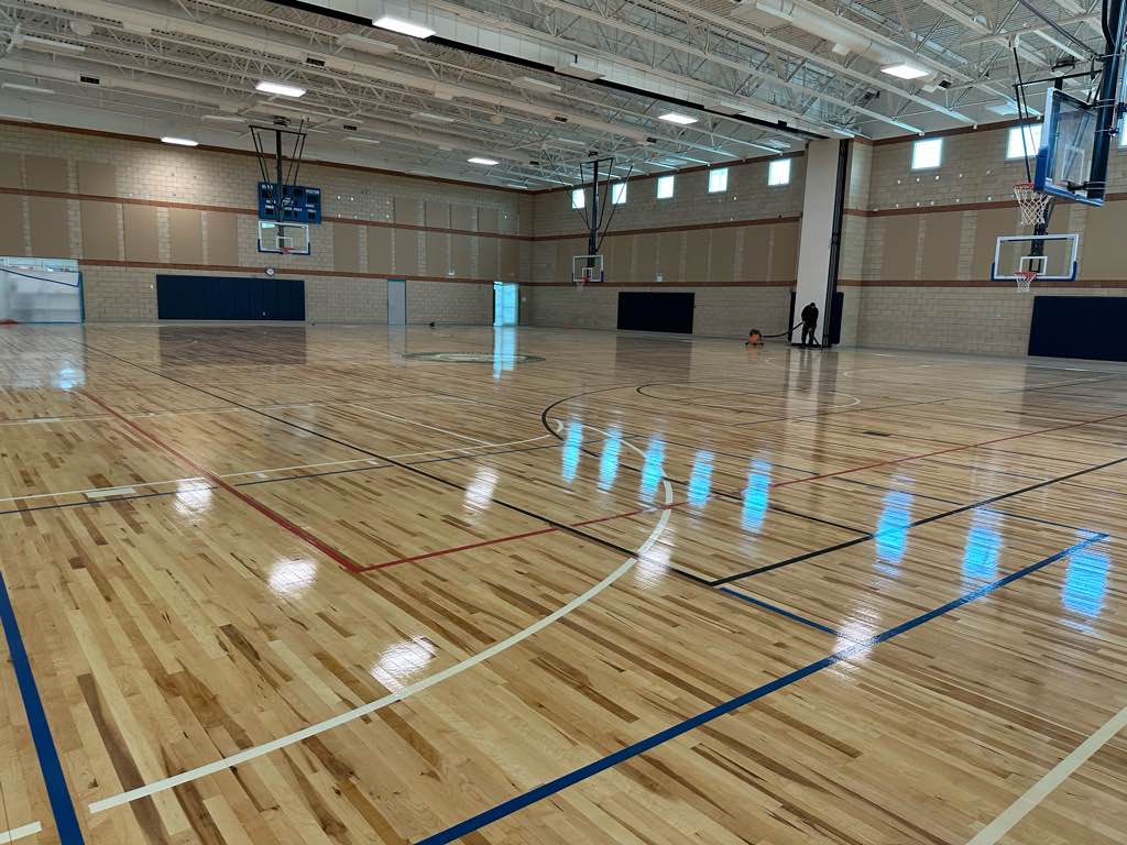 SynergyNDS's tweet photo. FMIT TurnKey Recovery Project Spotlight: SynergyNDS continues repairs at the Sanibel Recreation Center after the building was severely damaged by Hurricane Ian. Crews have finished installation of a new gym floor and are currently completing exterior repairs to the building. https://t.co/ve5m0ClBks