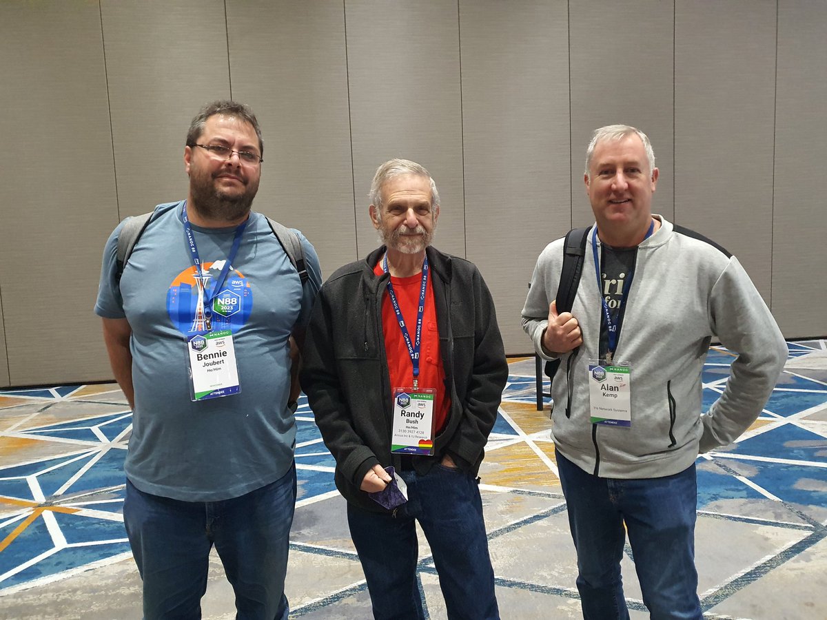 benniej86's tweet photo. During the last day of #NANOG #NANOG88 while on the #WorkonlineTour_2023 myself and #AlanKemp from @IRISnetworksys managed to get a picture with @enoclue (Randy Bush) that sent the first ICMP echo request / reply to South Africa(and much more) https://t.co/eYGXjPOnET