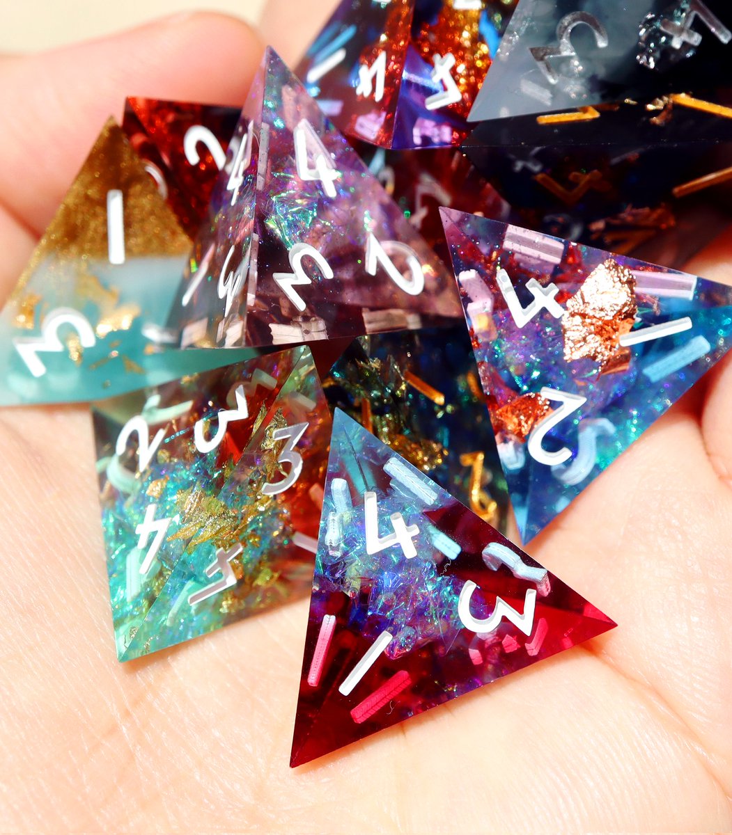 Can I offer you a handful of sparkly caltrops in this trying time? 😭 Random 4d4 sets are coming to our webstore this Thursday! #dnd #ttrpg #dice