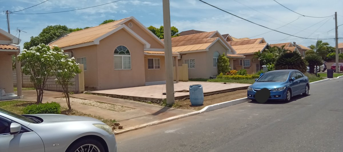 Meanwhile, in Portmore:

A ceramic tiled front lawn...