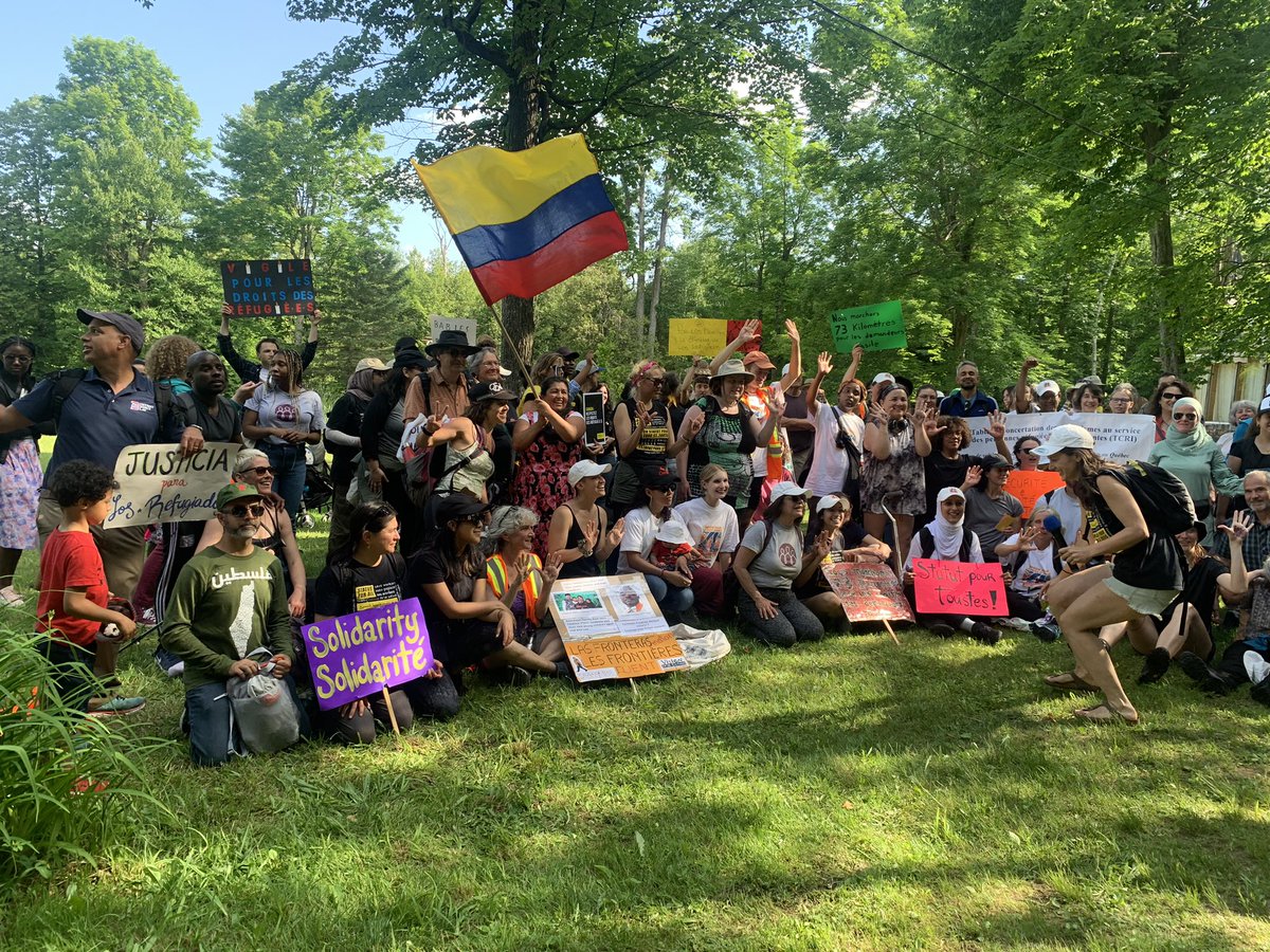 Macdonald2Laura's tweet photo. Marchers reach Roxham Road after 3 day hike to protest the closure of the border to people seeking refuge from danger and oppression https://t.co/W43l6vYwSw