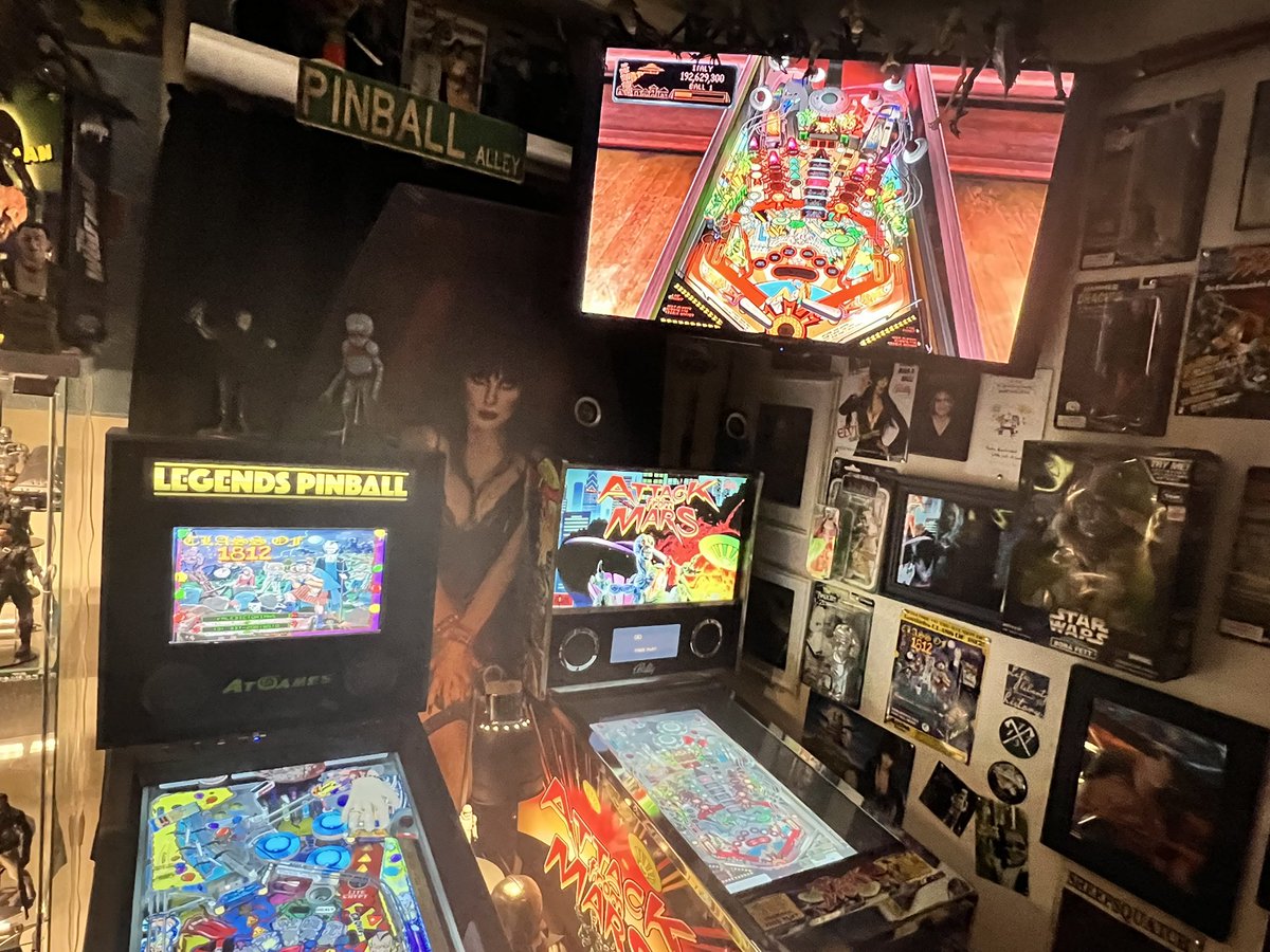 mwoods67037's tweet photo. Finally have my home pinball lounge completed. Thank you @bosshaas20 for getting me back into pinball. Setup streaming from my Attack from Mars VP table to the monitor above it. https://t.co/gqf6lloy7R