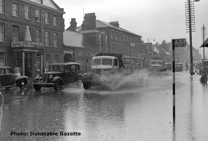 Flooding in High Street North in Dunstable town centre this morning and at the same spot 72 years ago.
You would have thought they'd have sorted it by now.