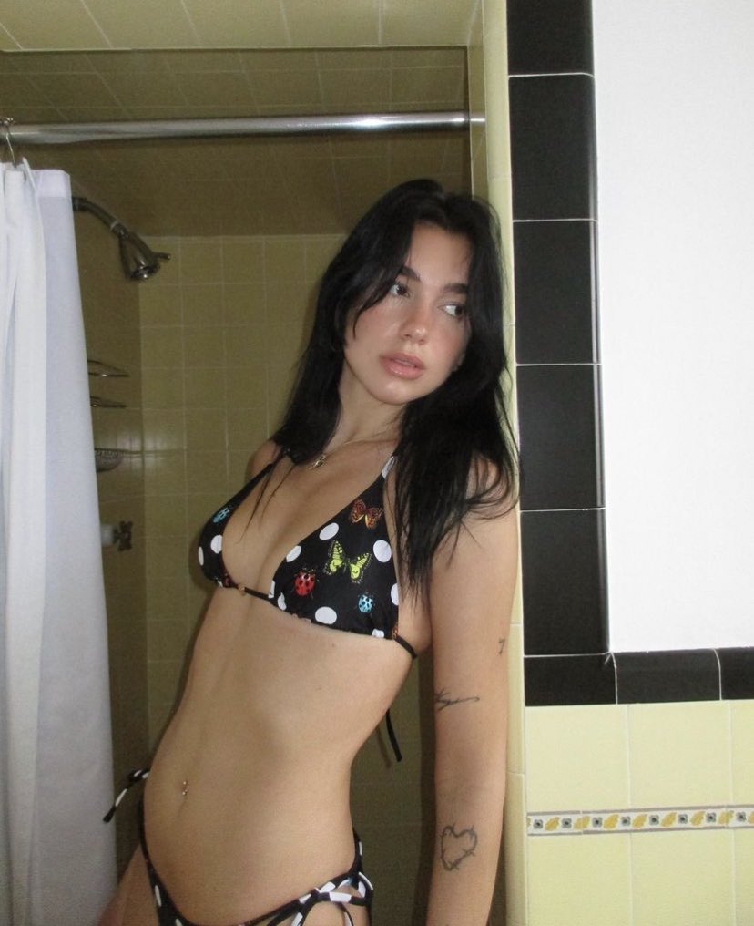 Dua Lipa stuns in bikini from her ‘La Vacanza’ collection with Versace.