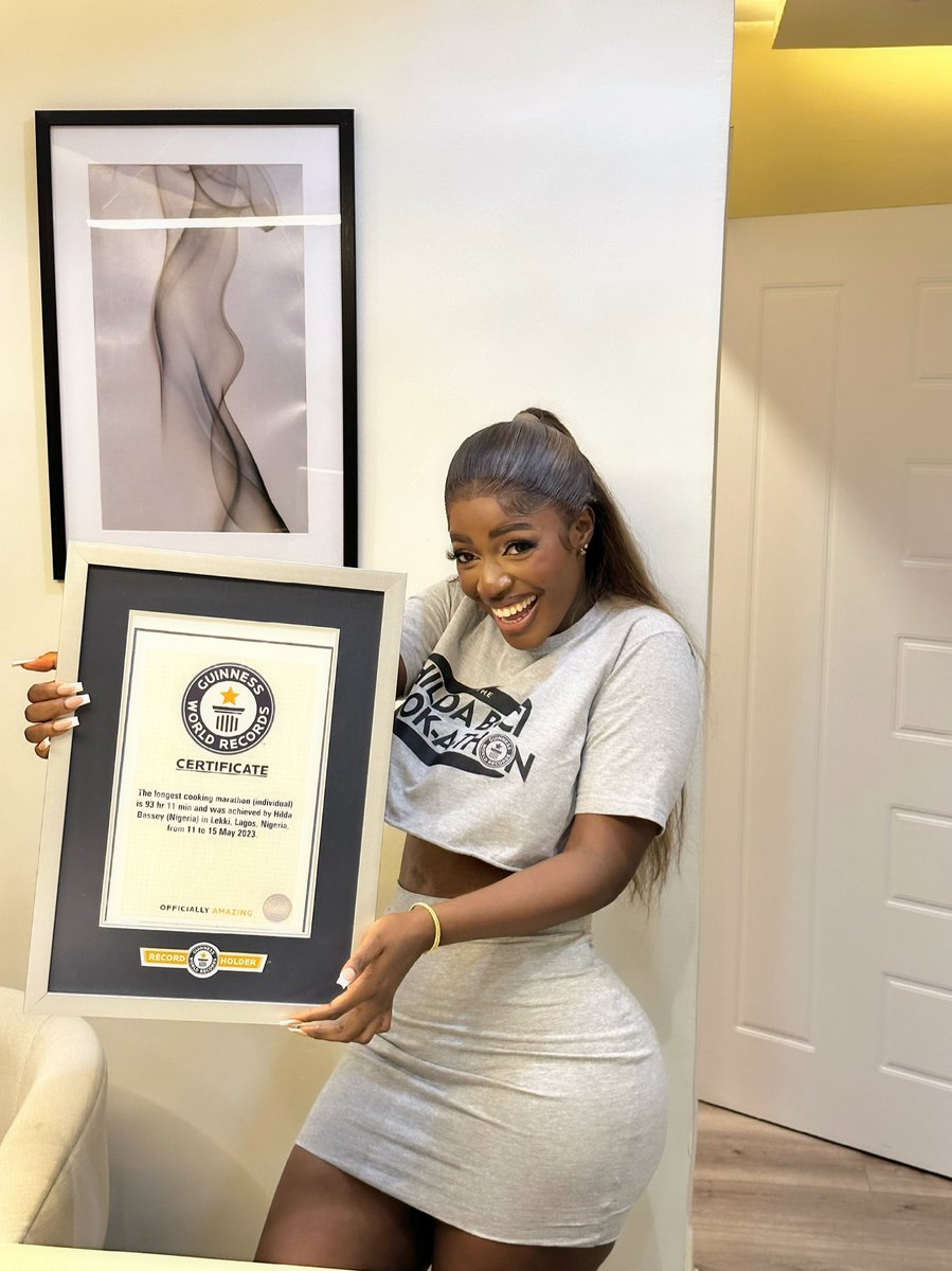 hildabacicooks's tweet photo. It feels so good to hold it I remember seeing a photoshopped picture of myself pointing at it and I said to God will have an original and he did it congratulations to all of us this is a collective win thank you all so much for your continuous love and support ❤️ https://t.co/WY4YtdfQIs