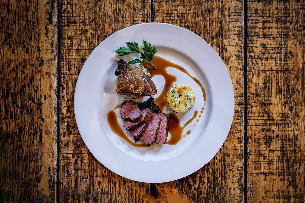 Delicious Duo of Duck

Confit crispy duck leg and grilled duck breast with red onion and goats cheese tarte tatin, braised red cabbage, roasted garlic and rosemary potatoes, and an orange and port sauce