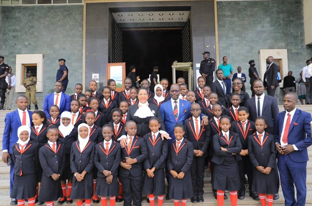 Sir Apollo Kisaasi pupils at Parliament after exchanging ideas.