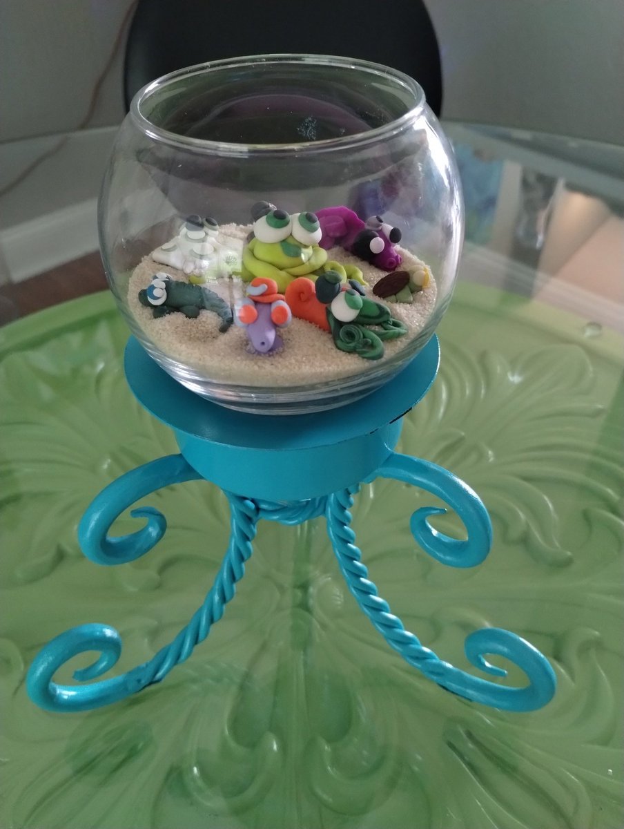 Repurposed a candle holder to hold a fish bowl filled with mini SeaToonz