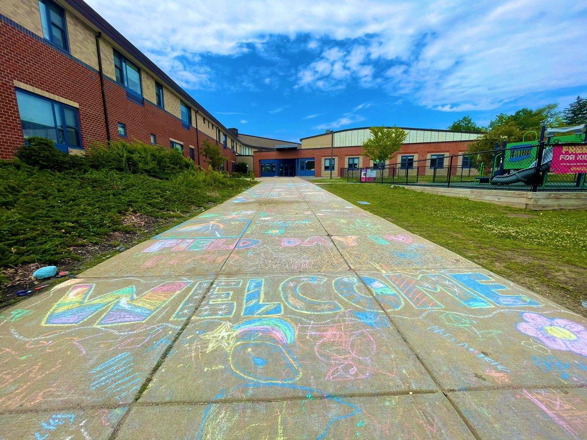 A beautiful chalk mural that summarizes our welcoming, happy and colorful school.