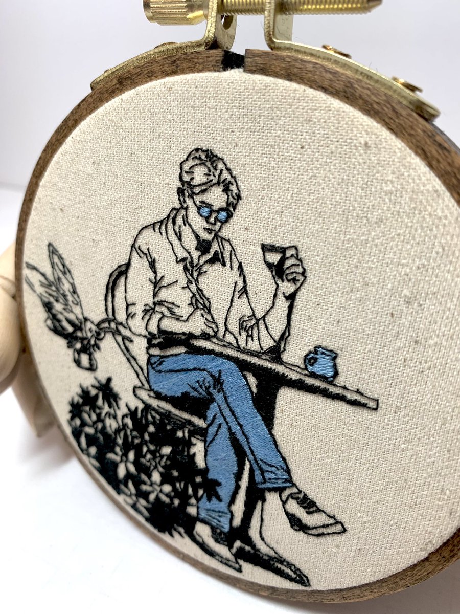 An 4x4 inch embroiderini of the Corinthian, chilling with a giant briefcase-carrying moth, drinking coffee while he writes in his diary with a feather pen. Just Nightmarey things. 

#embroidery #TheCorinthian #TheSandman