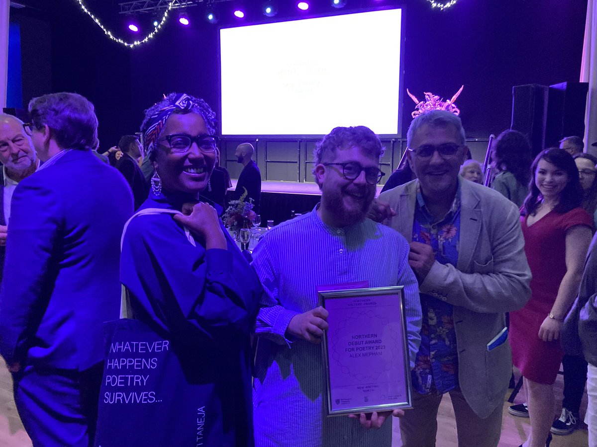 All the great #northernwritersawards winning poets modelling their pbs totes and unintentional floral crowns @DaljitNagra4, Alex Mepham @am3pham and Degna Stone!