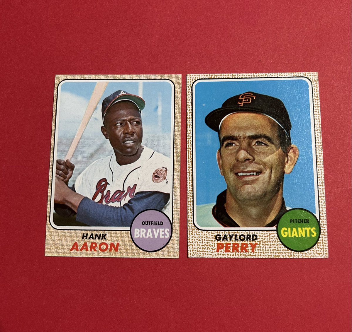 sportsguy_TO's tweet photo. Mail day brings us two ‘68 Topps HOFers. Thank you @DanTradesCards for the great deal on these two beauties. Need some help here I think the Aaron may be a Milton Bradley by the thin white line along the bottom and yellow back. Anyone else know for sure? #VintageCards #68Topps https://t.co/RN06VNjiVO