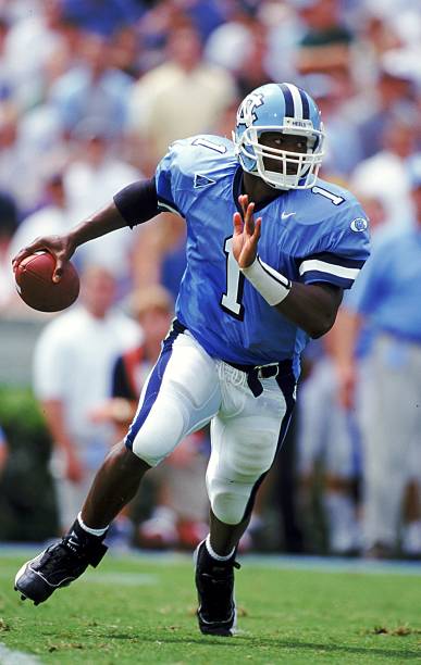 In 1999, Former Hampton Crabber and Tar Heel two sport star,  Ronald Curry runs the ball against UVA. #UNCommon #unc #tarheels #GoHeels #ACC #CarolinaFamily #CarolinaFootball #GDTBATH #UNCfootball PHOTO COURTESY OF:  Getty Images