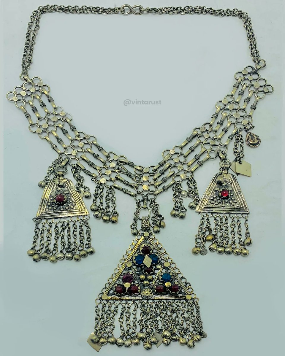 Tribal Silver Kuchi Necklace With Dangling Pendants. 

Shop Now:
buff.ly/42Smg26

#afghanitribaljewelry #statementpiece #traditionalcharm #finestquality #elegantjewelry #weddinggift #royallook #beadednecklace #silvercoins #tribalstyle #handmade #handmadeaccessories