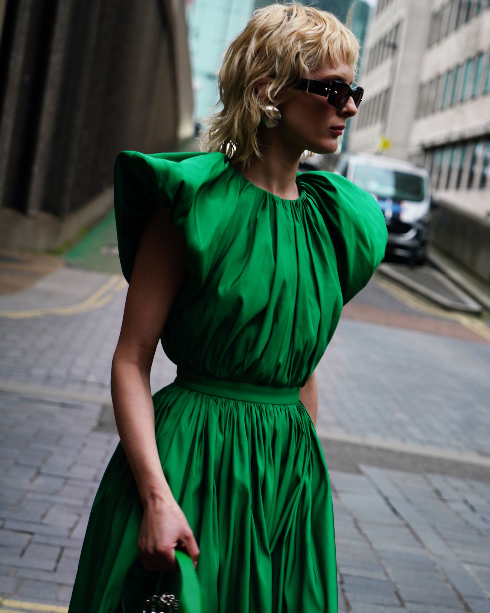 Alexander McQueen on X A bright green cap sleeve pleated dress with open back detailing worn with Spike Stud sunglasses and the Mini McQueenHoboBag. Discover the McQueenPreAW23 collection https t t...