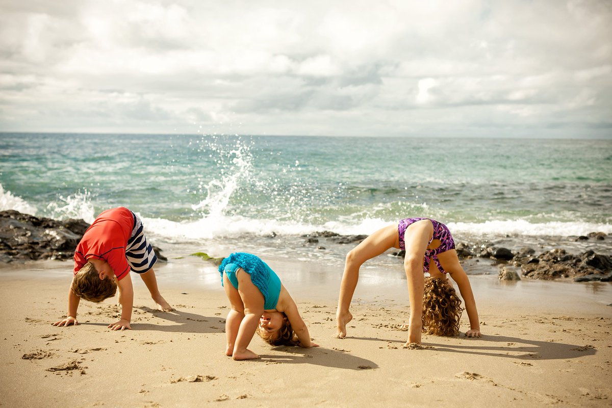 #HeadOverHeels. I can do anything better than you from #ScottMontgomeryPhoto. #DougTruppe #SummerSolstice #SummerBegins #InternationalDayOfYoga #DaylightAppreciationDay #portrait #kids #beach #summer #solstice #yoga #kidsyoga #CrabPose #ReverseTabletop #DownwardDog