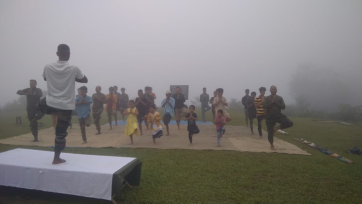 PemaKhanduBJP's tweet photo. योग चित्त-वृत्ति निरोध:।

Compliments to Assam Rifles on their efforts to promote Yoga at Hedman village on #InternationalYogaDay.

Practicing Yoga amidst scenic landscape and pleasant weather can enhance overall physical and mental health, giving a feeling of tranquility that is in harmony with nature.