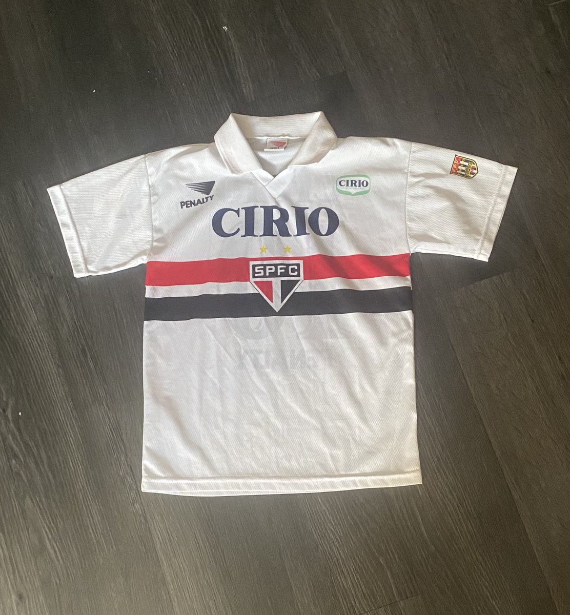 Liamcj19's tweet photo. So in Lisbon for a few days and stumbled across some football shirt finds in a flea market. I don’t think the São Paulo is legit but 5 euros worth the punt. The Cristano fan shirt is an essential out here, not bad for a euro. https://t.co/sP6pSRp5pI