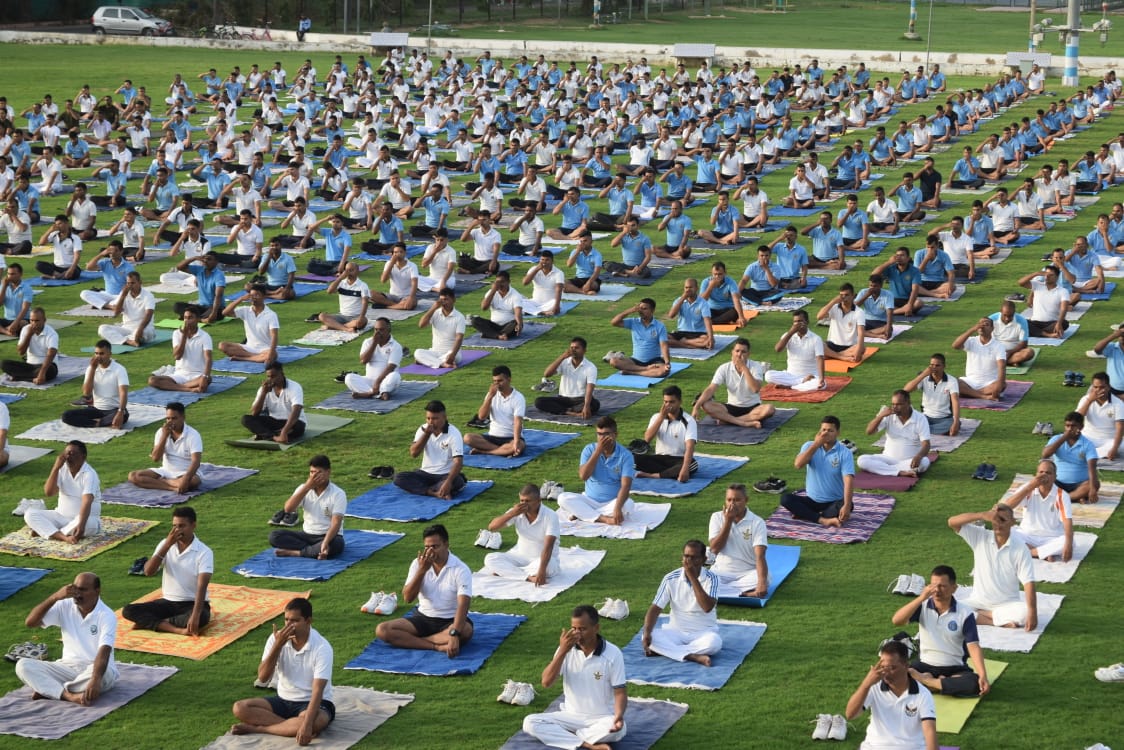 As part of #IYD23, all residents of #AirForce Station Bhuj including students of AF school and KV No.1 gathered to practice  #yoga asanas in the lush green sports ground. Swami PremManiji along with qualified  yoga instructors of the station conducted the session.
