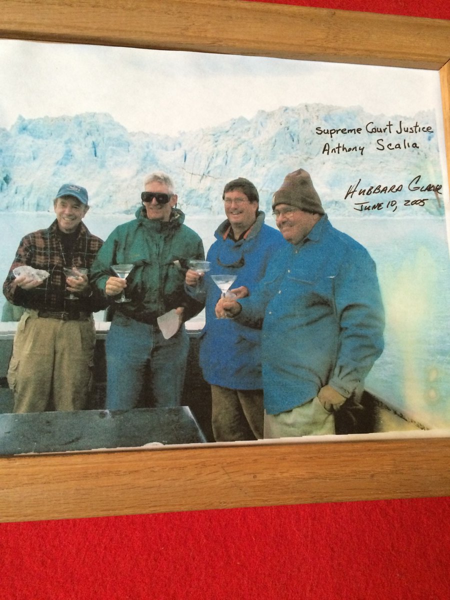 This photo is from a bar in a remote corner of Alaska.

On the right, Justice Scalia hoisting a martini made from glacier ice.

To his left, the FedSoc donor paying for the vacation. He flew the justice to Alaska on a private jet and rented out a lodge. propublica.org/article/samuel…