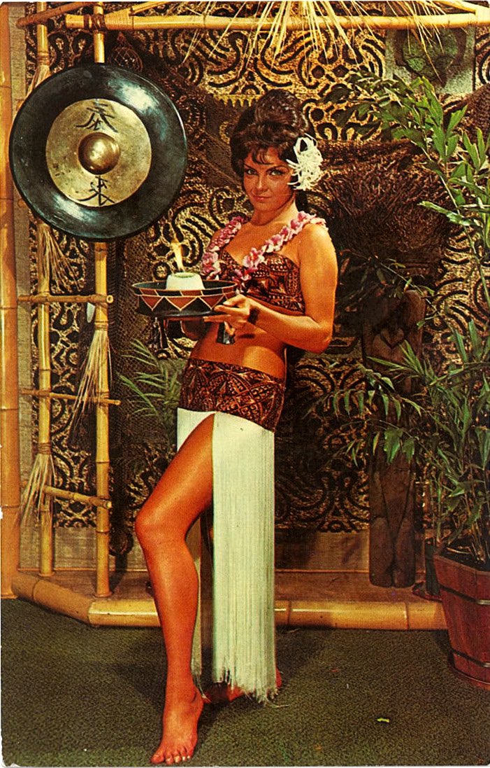 UDHCMH's tweet photo. C 1965 postcard of the Mystery Drink Girl at Columbus’ late, lamented Kahiki, one of the most amazing tiki restaurants ANYWHERE. Site is now an abandoned Walgreens and it’s cracked a weedy parking lot. #thecolumbusway https://t.co/ORN1I09HAO