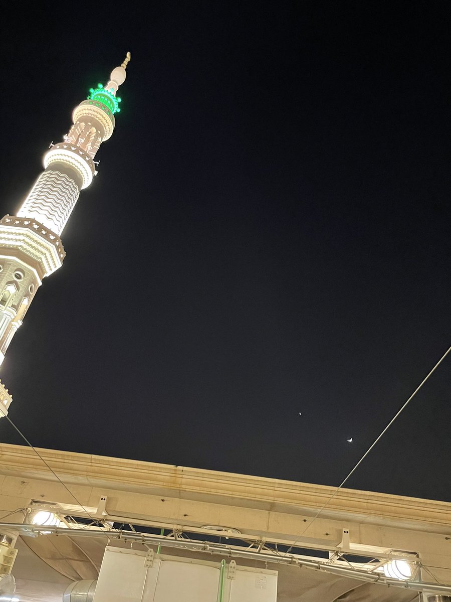 The minaret, the planet Venus, the Moon, and the line all aligned upon the night canvas of Medina.